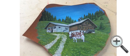 Chalet et vache sur cuir