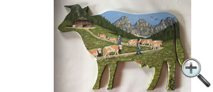 Poya sur vache en bois