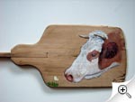 Portrait de vache sur planche à pain