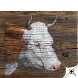 Vache sur planche