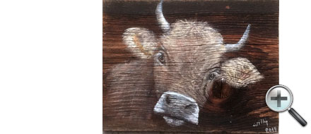 Tête de vache sur bois